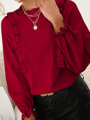 Burgundy ruffled yoke blouson sleeve top with ruffled cuffs.