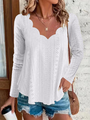 White scalloped eyelet yoke blouse with long sleeves and a sweetheart neckline.