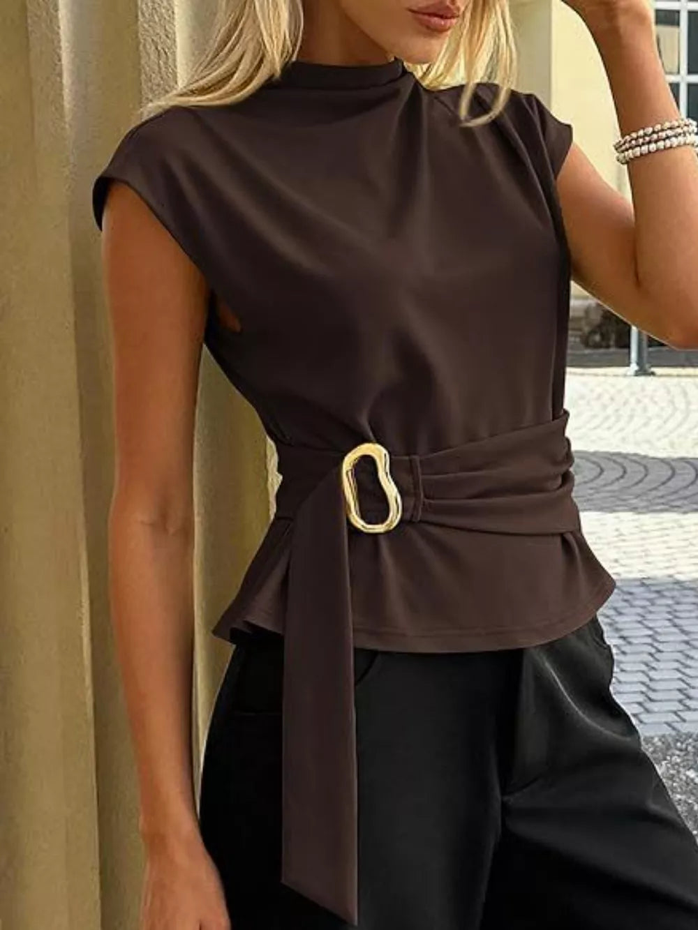 Coffee brown mock neck t-shirt with cap sleeves and a belted buckle detail.