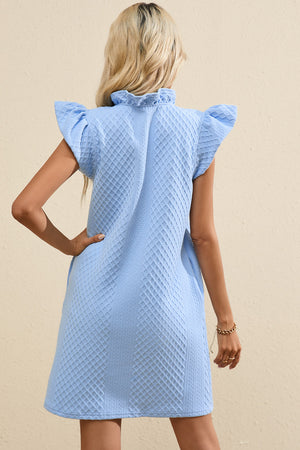 Light blue textured trapeze dress with ruffle sleeves and mock neck.