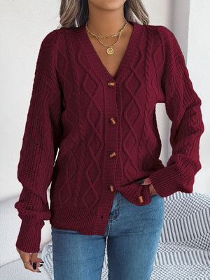 Burgundy cable knit cardigan with balloon sleeves and button front.