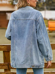 Relaxed fit washed denim trucker jacket in medium blue, button-down style.