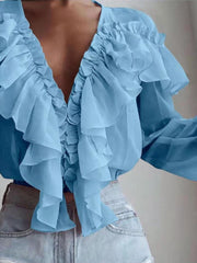 Sky blue chiffon ruffle plunge blouse with cascading ruffles.