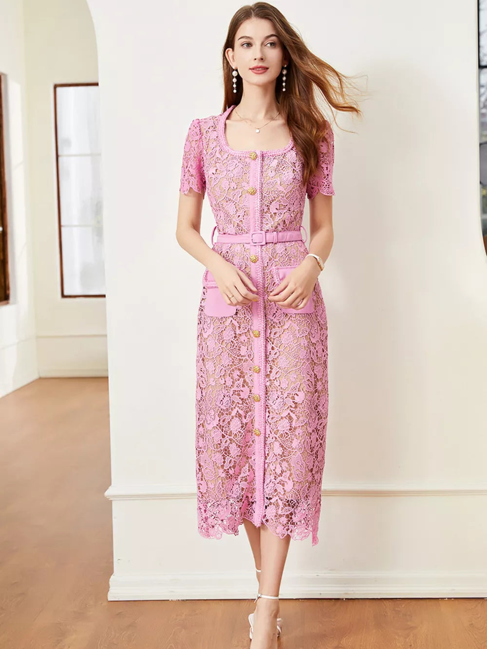 Pink lace midi dress with short sleeves, button front, belt, and pockets.
