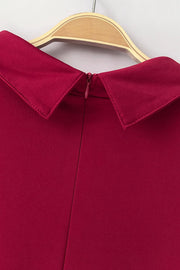 Deep Red high-neck jumpsuit with collar detail and zipper closure.