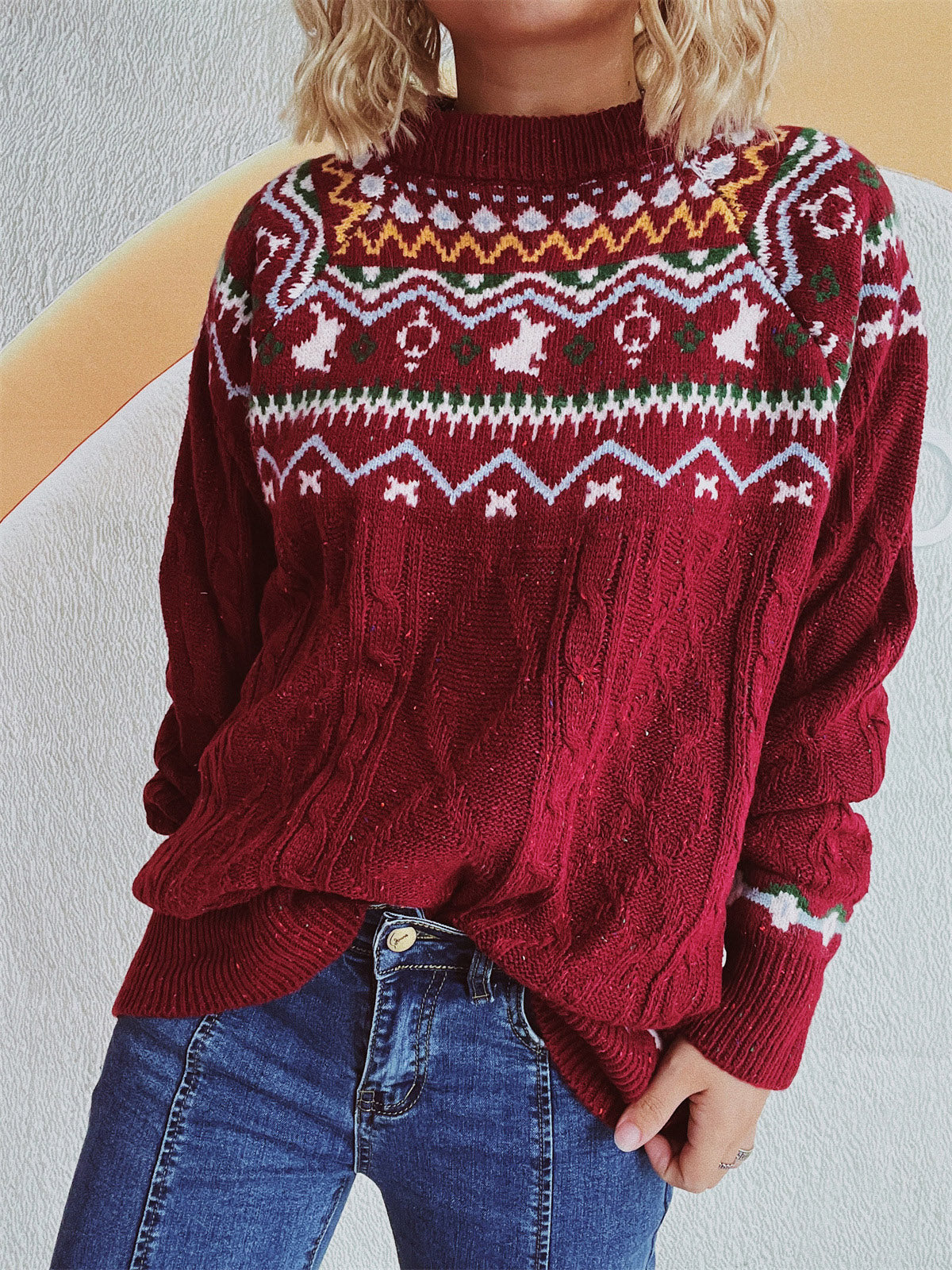 Burgundy Fair Isle cable knit turtleneck sweater with a festive pattern and textured sleeves.