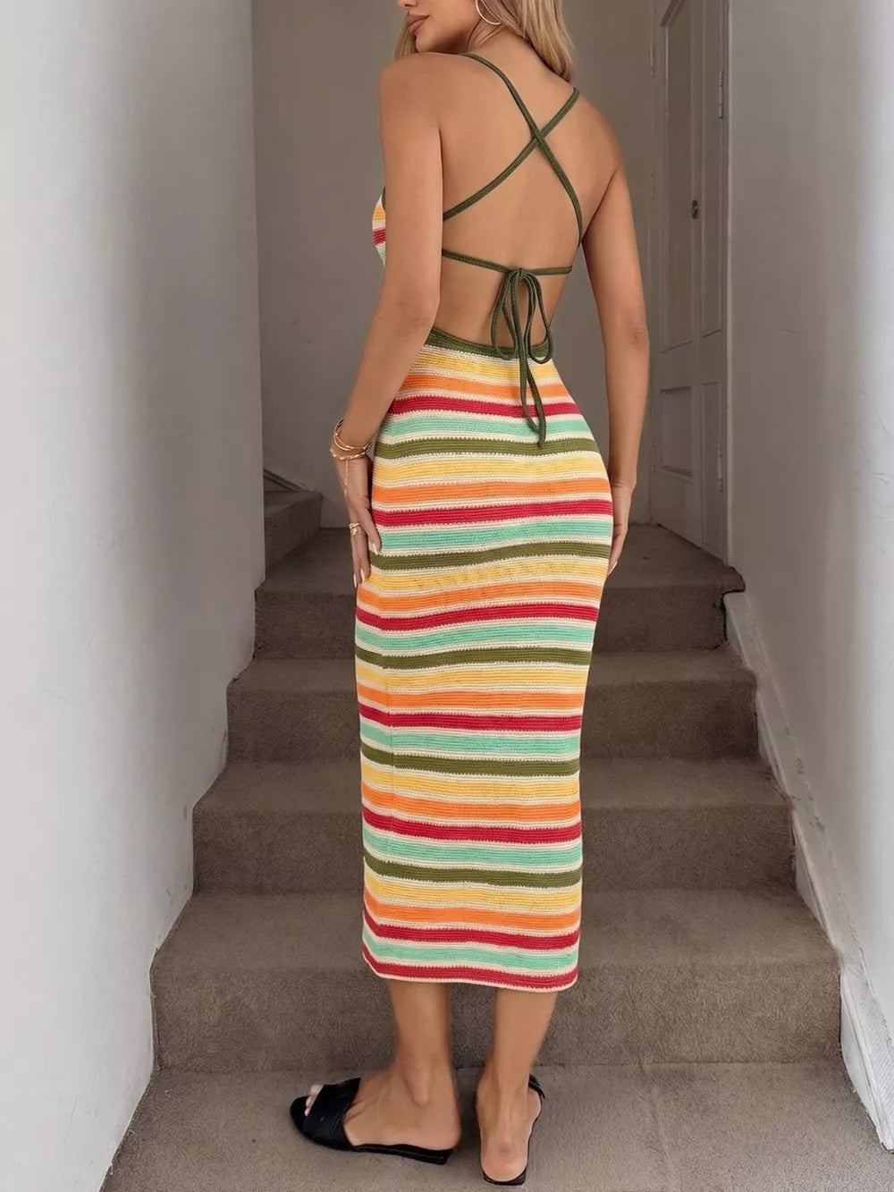 Vibrant striped bodycon midi dress with halter straps and open back.