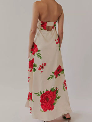 Ivory maxi dress with red floral print, gathered bodice, and open back detail.