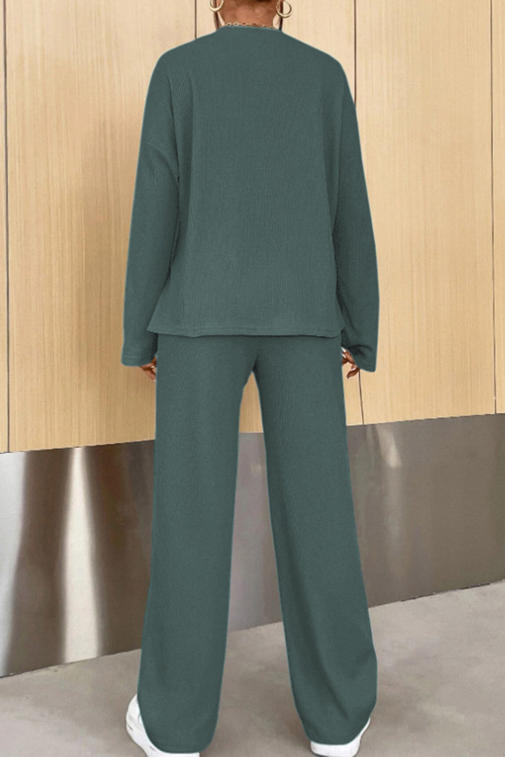Relaxed ribbed henley set in dark green with wide leg pants and long sleeves.