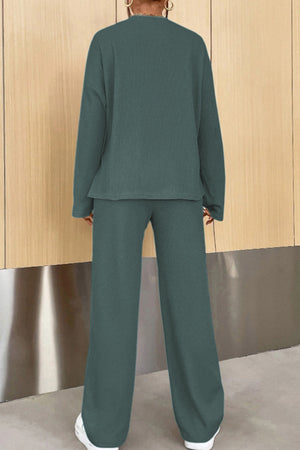 Relaxed ribbed henley set in dark green with wide leg pants and long sleeves.