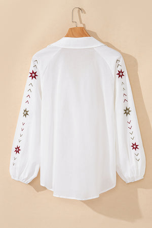 White embroidered eyelet blouse with poet sleeves and star detail