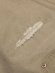 Khaki cargo pants with distressed detail and contrast stitching.
