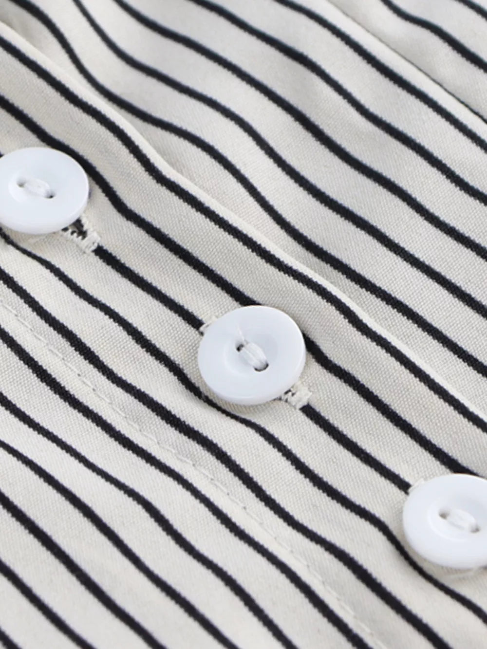 Maternity shirt with black and white stripes and white buttons.