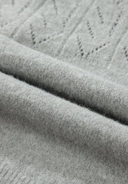 Gray lace-effect knit cardigan with a textured stitch pattern and button-down front.