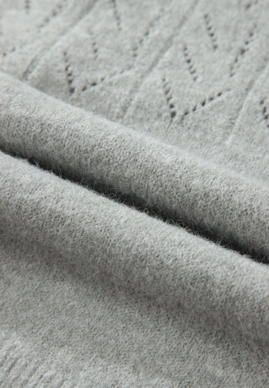 Gray lace-effect knit cardigan with a textured stitch pattern and button-down front.