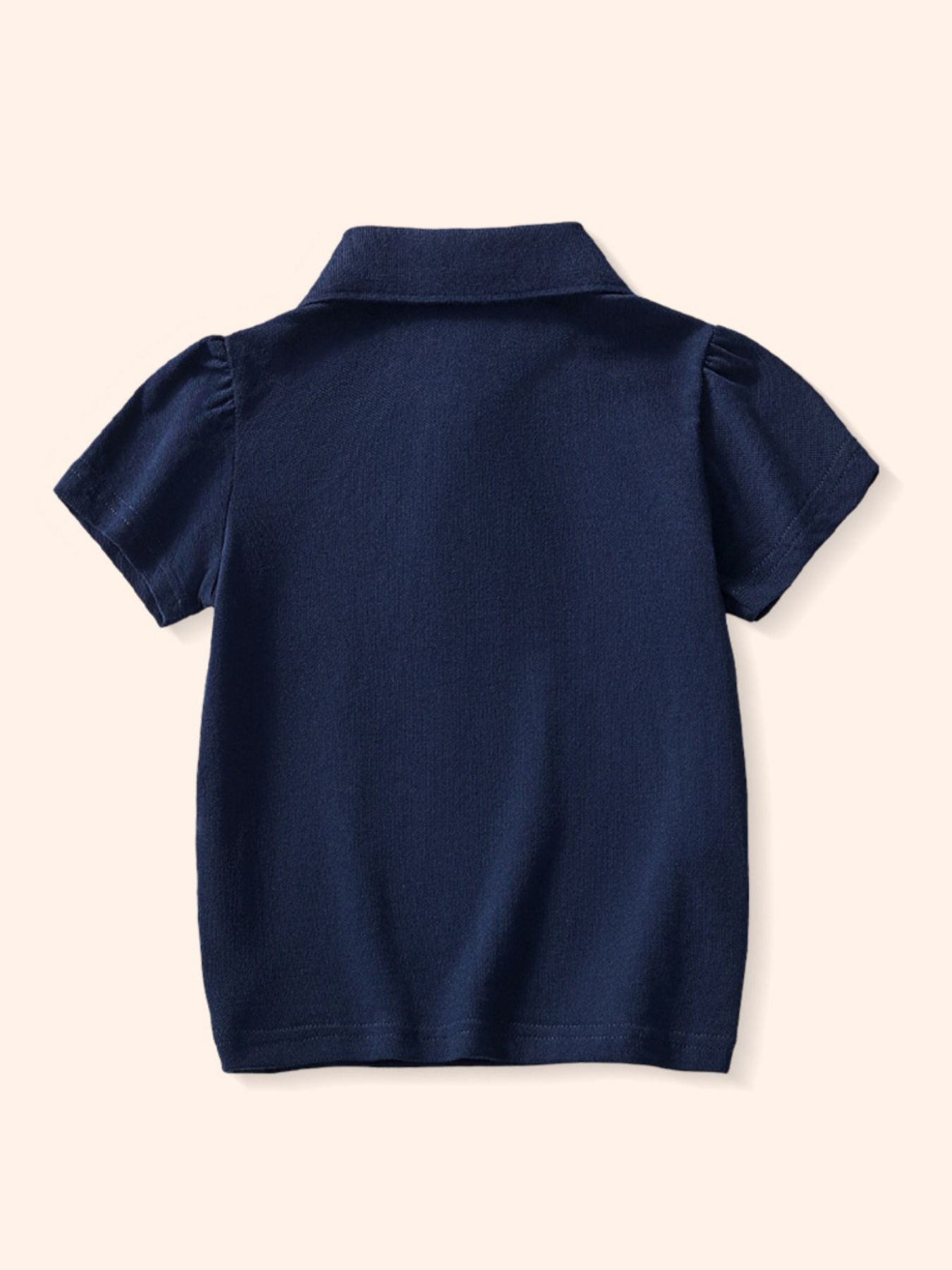 Navy blue toddler polo shirt with short puff sleeves and a classic collar.