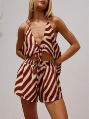 Backless halter neck two-piece set with deep v-neck and drawstring shorts in a zebra print.