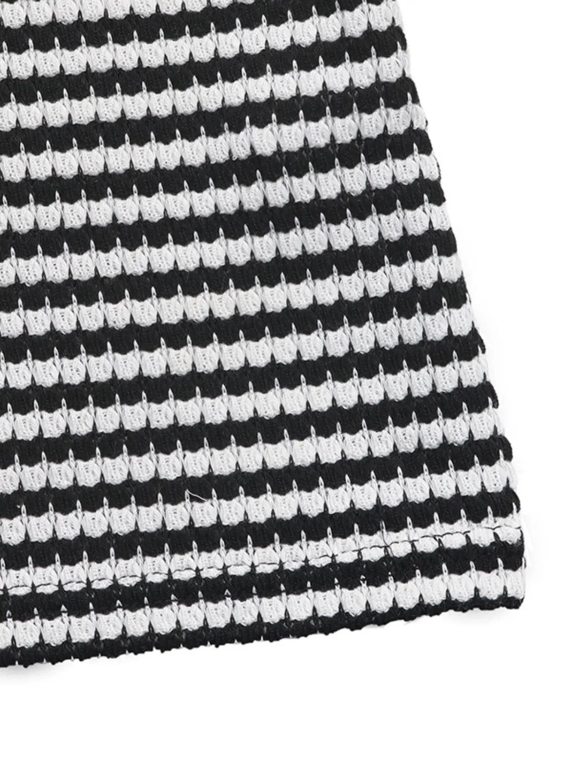 Black and white striped bustier romper with textured knit fabric