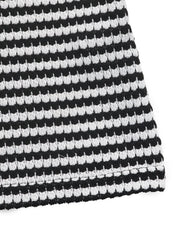Black and white striped bustier romper with textured knit fabric
