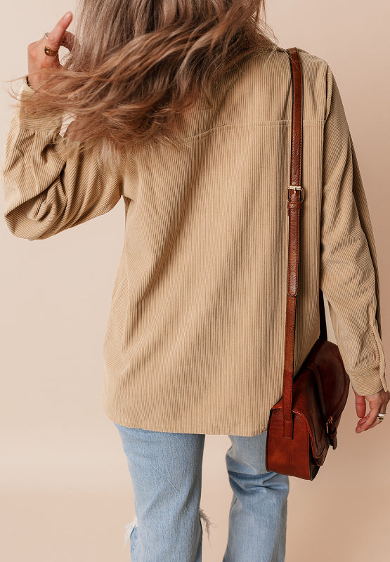 Tan corduroy utility shirt with ruffled pockets, long sleeves, button front, and a relaxed fit.