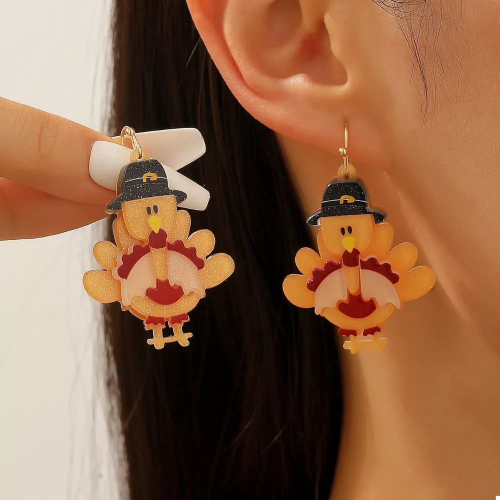 Thanksgiving turkey charm dangle earrings in acrylic and alloy, featuring pilgrim hats.