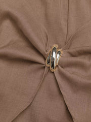 Brown twist-front skort with a decorative silver button detail.