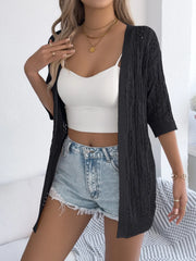 Black open-knit three-quarter sleeve cardigan with cable knit detail
