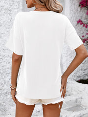 White ribbed V-neck t-shirt with short sleeves and a pocket detail.