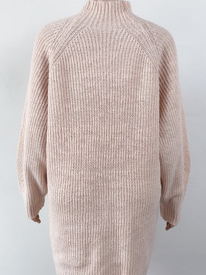 Ribbed knit cocoon turtleneck dress in blush pink with long sleeves and a relaxed fit.