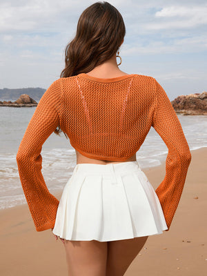 Orange crochet crop top with flared sleeves and open knit detail