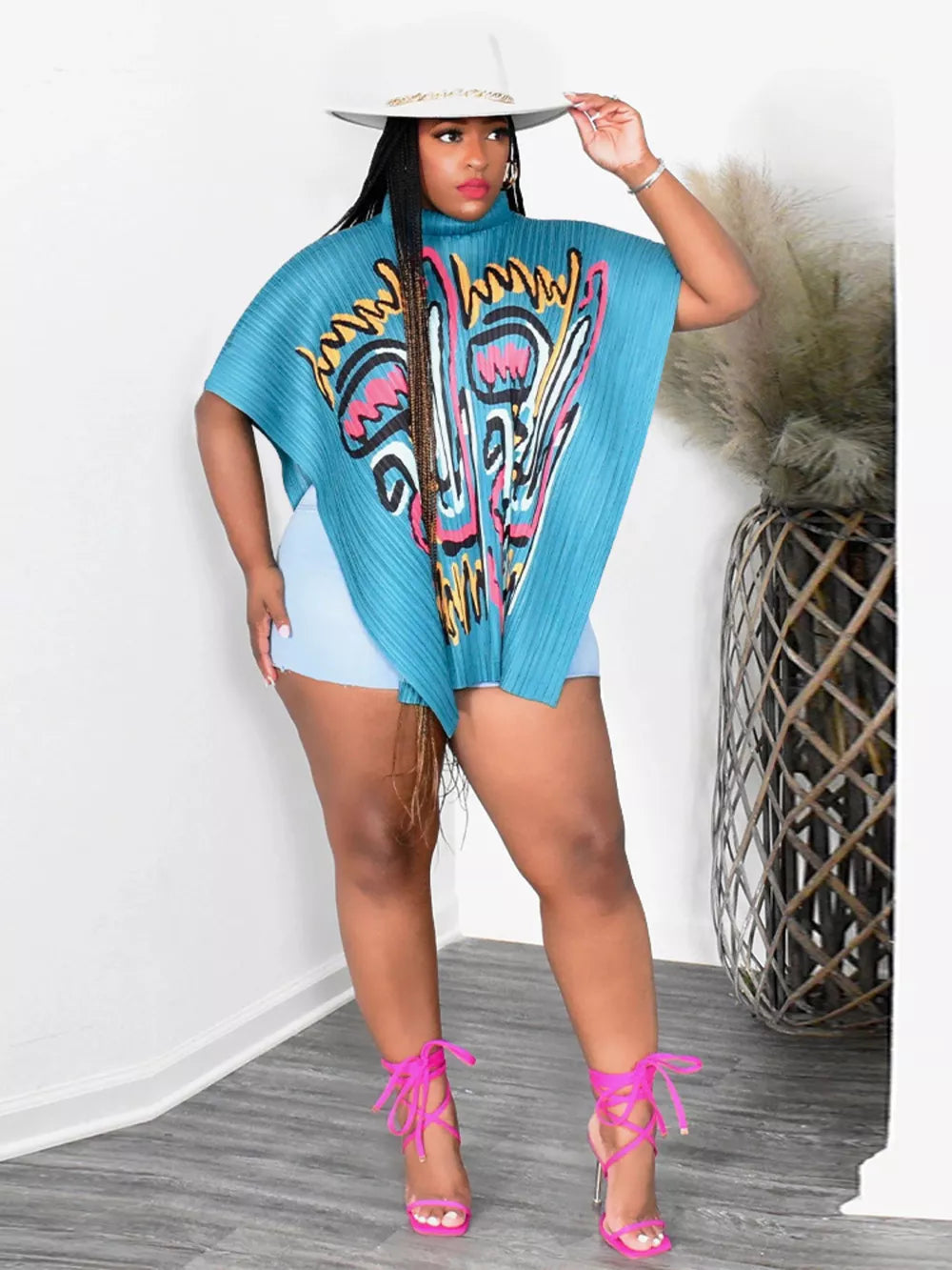 Light Blue abstract print pleated cape shirt with a mock neck, oversized fit, and short sleeves.