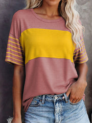 Loose fit t-shirt with dusty pink and yellow color block, striped sleeves, and crew neck.