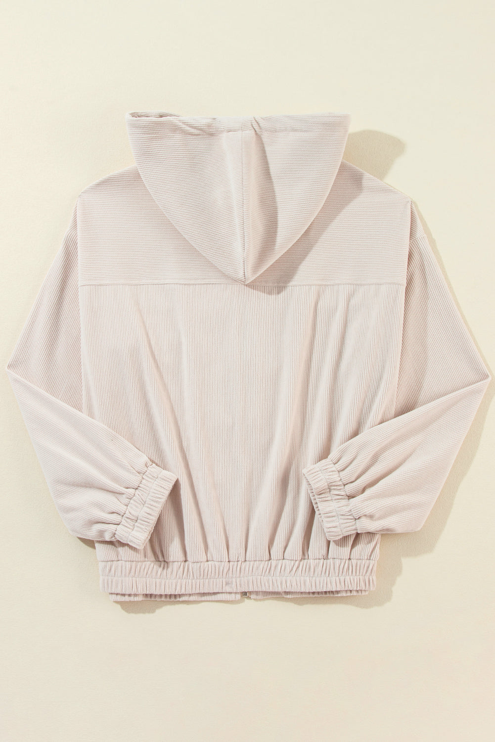 Cream corduroy bomber hoodie with relaxed fit, elastic cuffs and hem