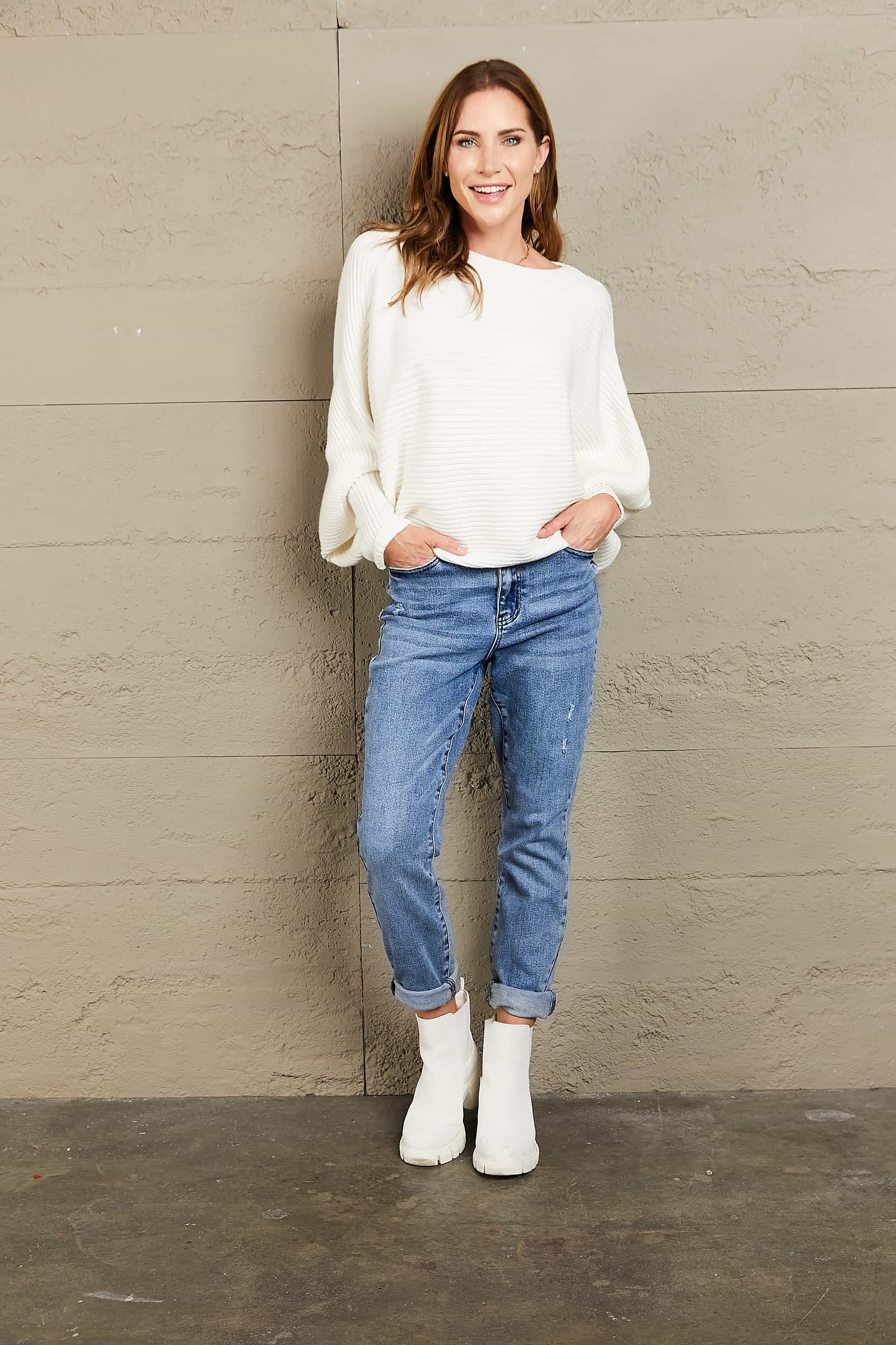 White ribbed dolman knit sweater with boat neck and balloon sleeves.