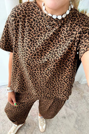 Leopard print relaxed fit two-piece set with short sleeves and wide-leg pants.