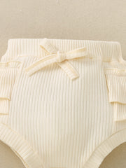 Cream ribbed baby bloomers with ruffle trim and a bow detail