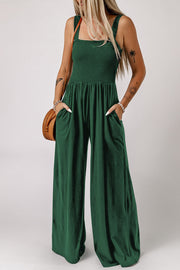 Green smocked square neck wide leg jumpsuit with pockets