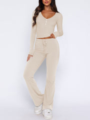 Beige ribbed loungewear set with long sleeve v-neck top and drawstring flare pants