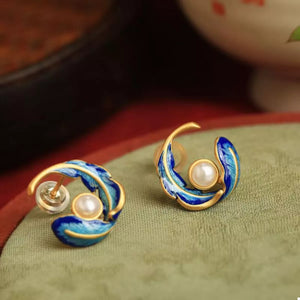 Blue pearl feather earrings with gold accents