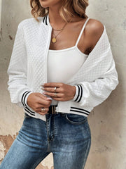 White quilted bomber jacket with striped ribbing on cuffs and collar.