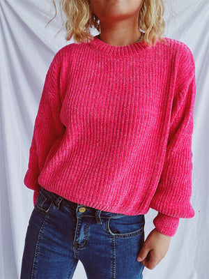 Textured ribbed knit crewneck pullover sweater in bright pink with relaxed fit.