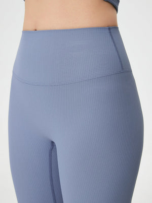 Light blue ribbed high-waist leggings with a sculpted fit.