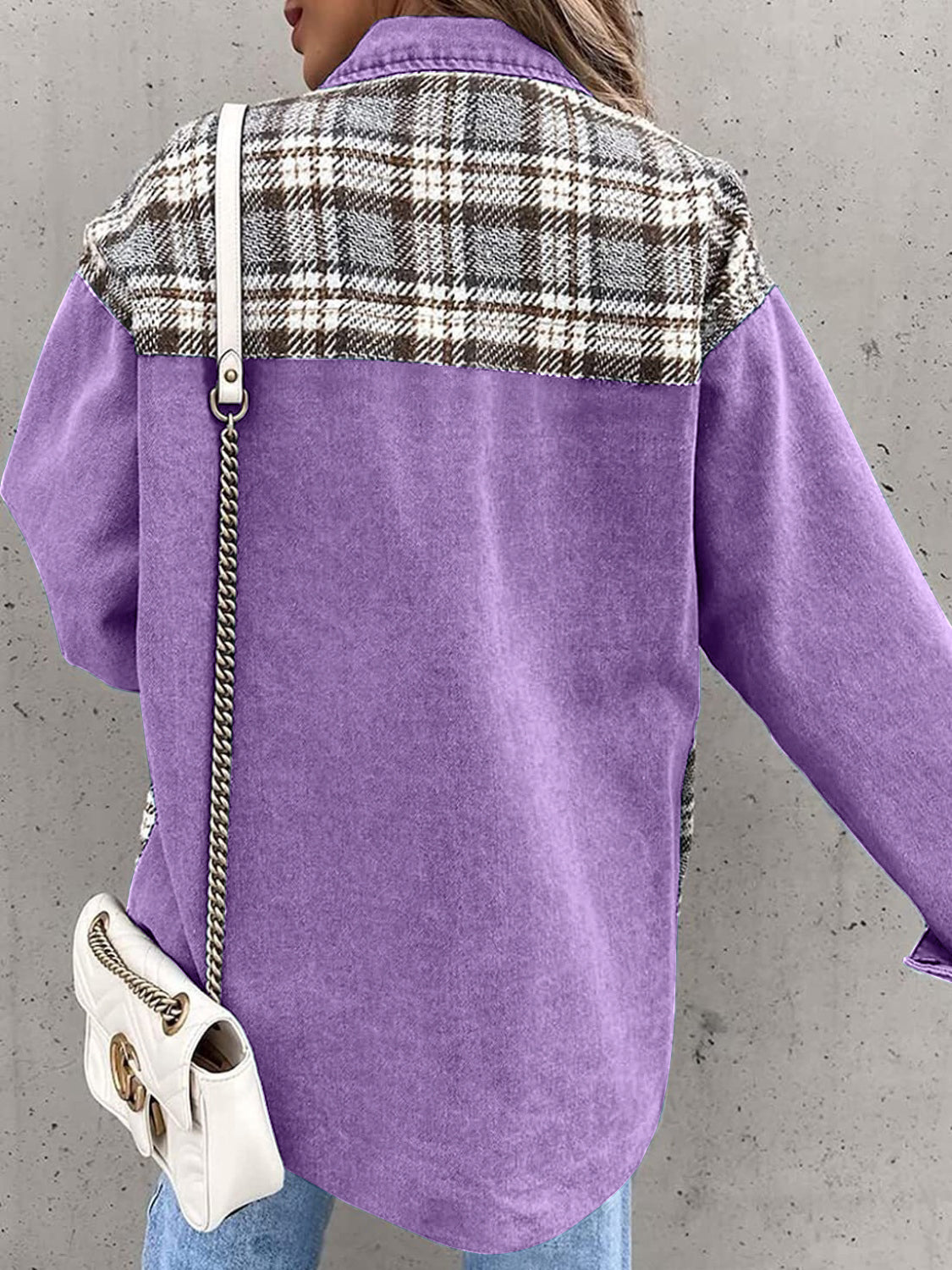 Purple denim jacket with plaid paneling on shoulders and sleeves.