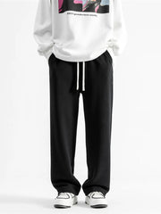 Black relaxed fit drawstring wide-leg sweatpants with white drawstrings.