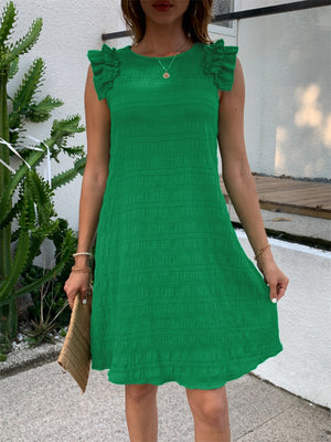 Green textured ruffle shoulder mini dress with a textured pattern.