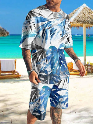 Men's two-piece set with blue and white tropical leaf print, crew neck t-shirt and shorts.
