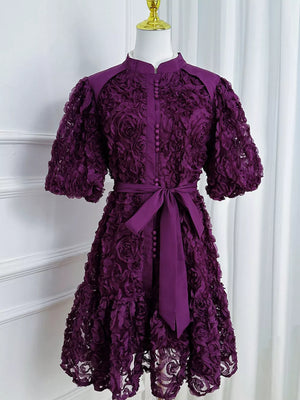 Purple floral puff sleeve dress with button-down front and tie waist