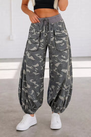 Camouflage barrel pants with cargo pockets and drawstring waist.