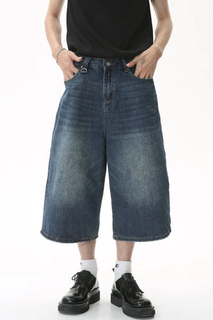 Wide-leg denim culottes in light blue with a relaxed fit and distressed details.