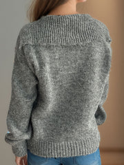 Textured knit sweater in dark gray with a wide ribbed collar and cuffs.